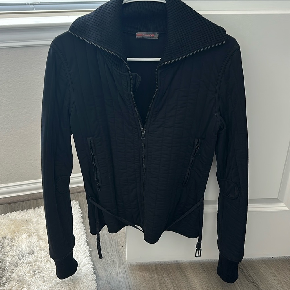 Prada belted jacket.